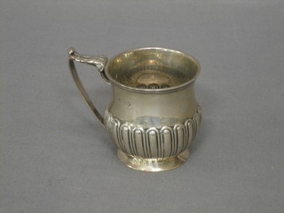 A Georgian silver christening tankard with demi-reeded decoration raised on a circular spreading foot, marks rubbed 2"