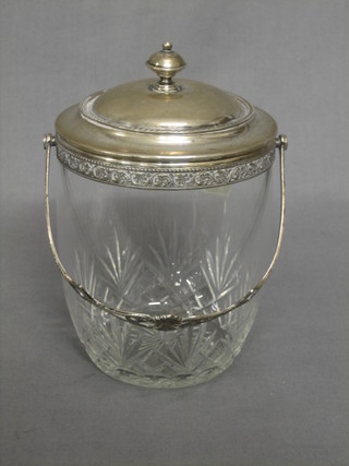 A circular Continental cut glass biscuit barrel with white metal mounts