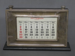 A modern silver perpetual calendar