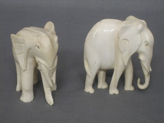 2 carved ivory figures of elephants 3"