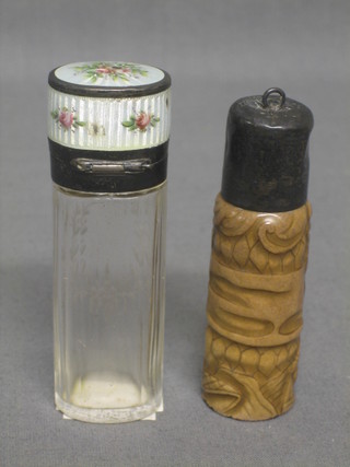 A 19th Century oval etched glass scent bottle with enamelled hinged lid with floral decoration (stopper missing) 3", together with an Eastern porcelain scent bottle decorated figures with silver lids 3"