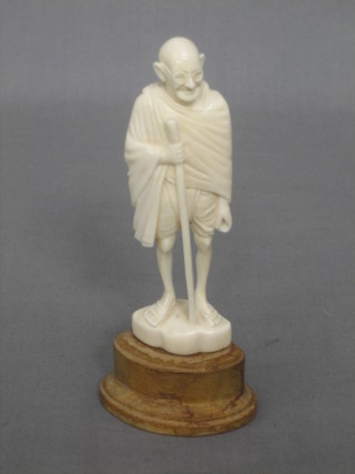 A carved ivory figure of a standing Ghandi 4 1/2"