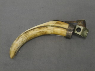 A horn mounted cigar cutter