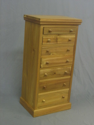 A Victorian style bleached mahogany pedestal chest of 7 drawers with tore handles, raised on a platform base 18"