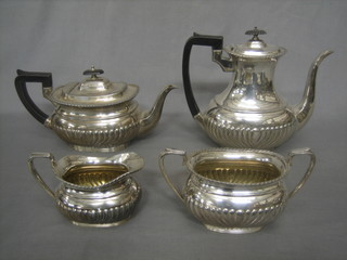 A 3 piece Britannia metal oval shaped tea service with demi-reeded decoration comprising teapot, coffee pot, twin handled sugar bowl and cream jug