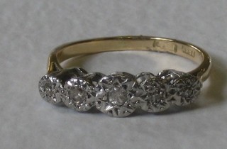 A lady's 18ct gold dress ring set 5 illusion set diamonds