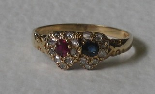 A lady's 18ct gold dress ring in the form of 2 entwined hearts set sapphires and diamonds
