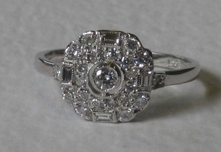 A lady's 18ct white gold cluster dress ring set diamonds, approx 0.66ct