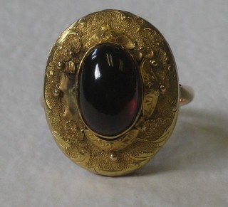 An 18th Century gold ring set a cabouchon cut garnet