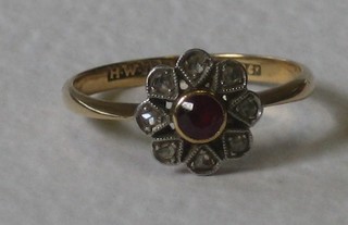 A lady's 18ct yellow gold dress ring set a ruby and diamonds