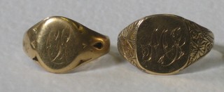 A lady's 18ct gold signet ring and 1 other (cut)