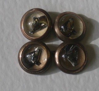 A pair of rock crystal cufflinks decorated horses heads