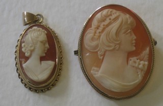 A shell carved cameo portrait pendant contained in a gold mount together with an oval cameo brooch 