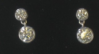 A pair of diamond double ear studs, approx 1.20ct