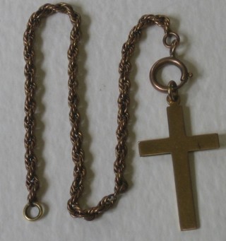 A 9ct gold cross and a fine gilt metal bracelet