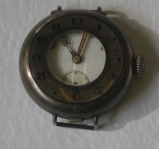 A wristwatch contained in a half hunter silver case