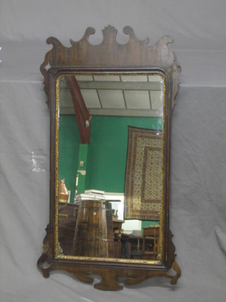 A 19th Century Chippendale style mirror contained in a mahogany frame 39"