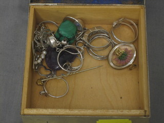 A quantity of various silver rings and costume jewellery contained in a silver plated and enamelled box with hinged lid