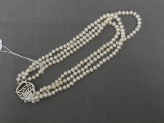 A modern rope of cultured pearls with with mother of pearl clasp