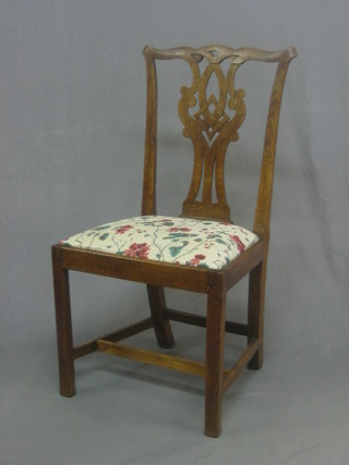 A Chippendale style Country oak slat back dining chair with upholstered drop in seat, raised on square tapering supports