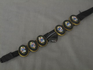 A micro mosaic bracelet formed from 6 oval floral decorated panels