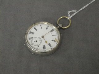 An open faced pocket watch contained in a silver case (dial cracked)