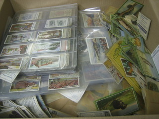 A box of various Cigarette cards