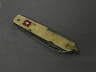 A 4 bladed Swiss Army pen knife with Merlin spike and corkscrew, the blade marked Eperon D'or Paris