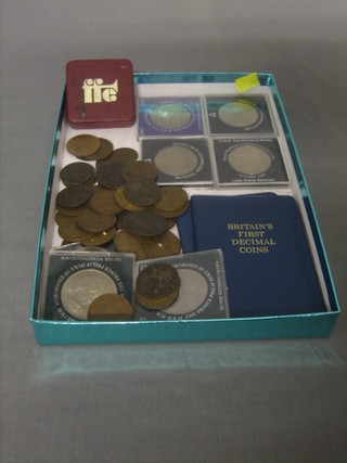 A collection of various crowns and coins