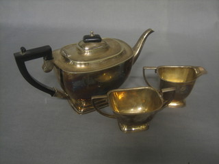 An Art Deco oval 3 piece silver plated tea service comprising teapot, twin handled sugar bowl and cream jug