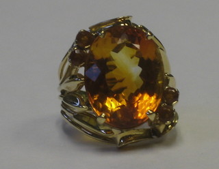 A 14ct yellow gold dress ring set an oval cut citrene
