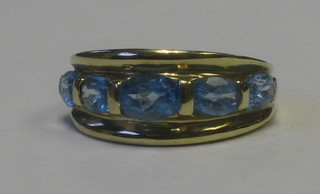 A 9ct gold dress ring set 5 oval cut blue Topaz