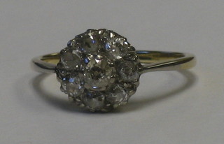 An 18ct gold cluster dress ring set numerous rose cut diamonds