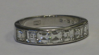 A lady's 18ct white gold half eternity dress ring set 7 square cut diamonds, approx. 2.30ct