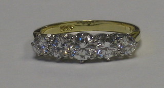 A lady's 18ct yellow gold engagement/dress ring set 5 diamonds, approx 1.35ct