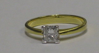 A lady's 18ct yellow gold dress ring set a square cut diamond