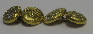 A pair of 18ct engraved circular gold cufflinks