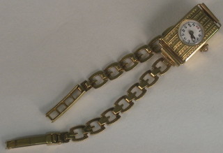 A lady's wristwatch contained in a 9ct gold case with integral bracelet
