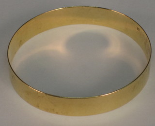 A foreign gold bangle marked 18c (believed to have been purchased in the 1920's)