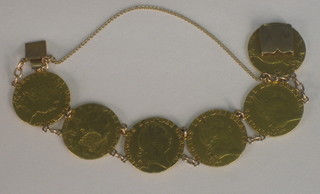 A gold bracelet formed from 6 Georgian spade guineas