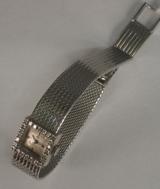 A lady's Omega cocktail wristwatch contained in an 18ct white gold case set diamonds