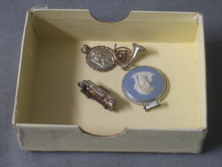 A Wedgwood pendant and a silver St Christopher medal and 2 other small charms
