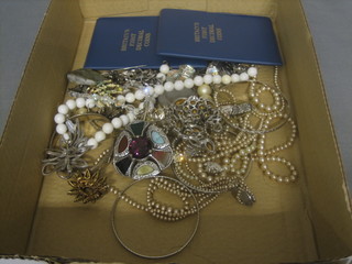 A collection of costume jewellery and a small quantity of coins