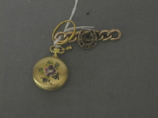 A 22ct gold wedding band, a gold curb link brooch decorated a horse shoe and a gilt metal fob watch