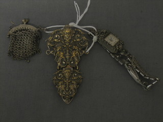 A cocktail wristwatch contained in a marcasite case, a miniature chain mail evening purse and a chatelaine clasp