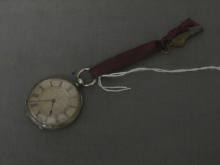 A Continental open faced fob watch contained in a silver case