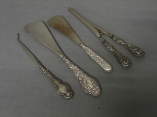 2 silver handled shoe horns, do. button hook and a pair of glove stretchers