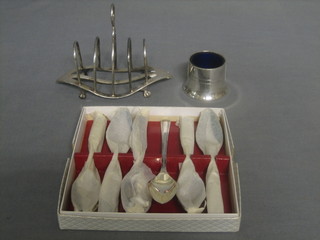 A circular silver plated salt, a 5 bar silver plated toast rack and 6 silver plated grapefruit spoons