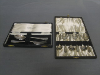 A silver plated christening set comprising knife and spoon and 6 silver plated teaspoons, cased