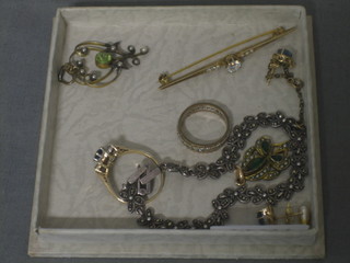 An Edwardian gold pendant set Peridot and pearls and a small collection of costume jewellery